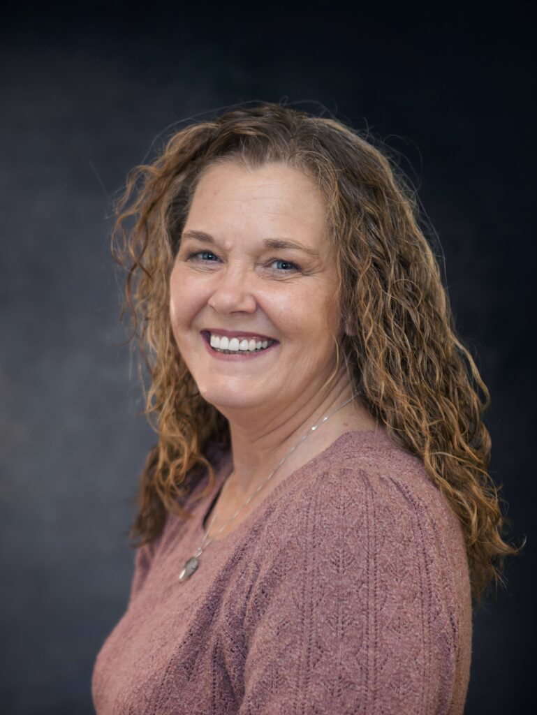 Angie Street with her cozy mystery books